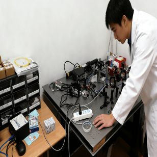 person using crane to move industrial gear box in engineering factory